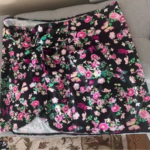 Victoria’s Secret black floral swim skirt with butterflies.